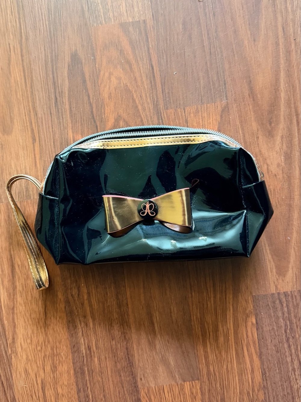 Anastasia Beverly Hills Black Patent Cosmetic Wristlet with Gold Bow